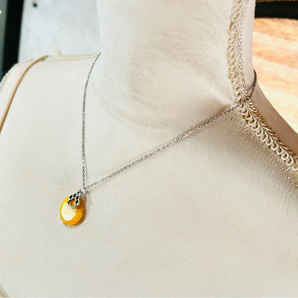 Handcrafted mustard yellow mother of pearl paw charm pendant on chain necklace